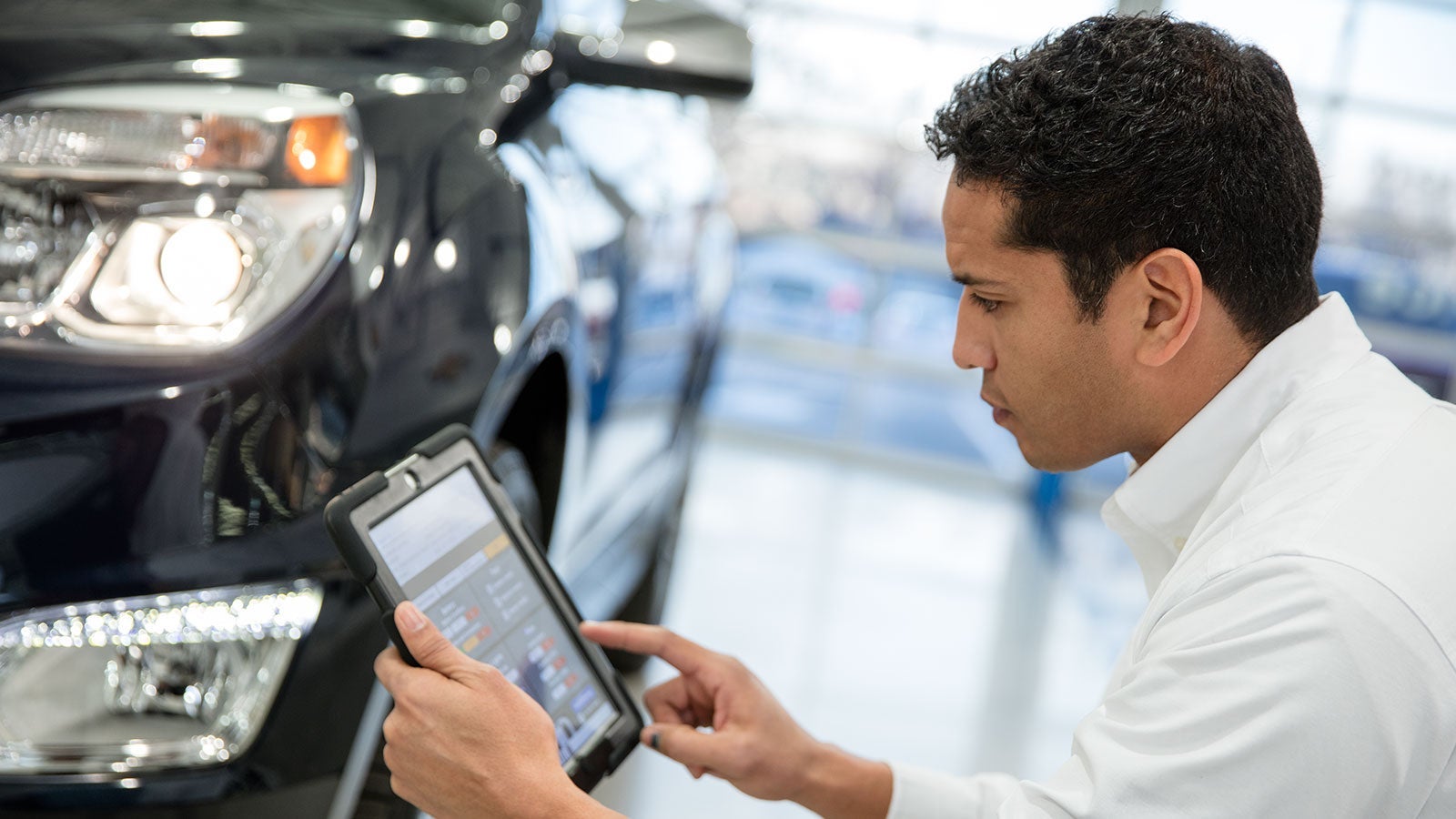 A Chevrolet service technician performing vehicle diagnostics